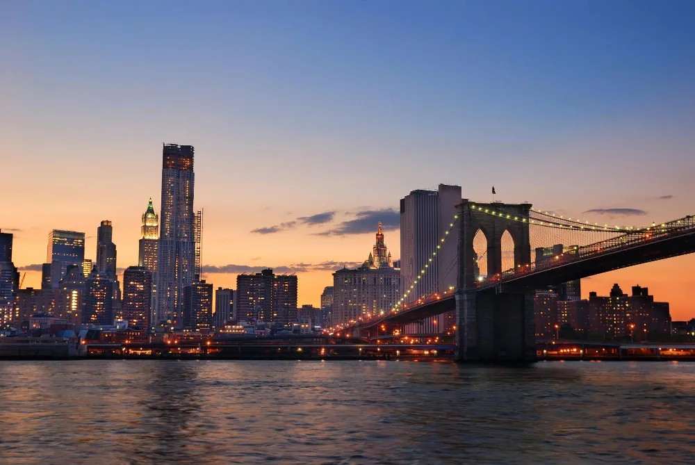 The Brooklyn Bridge and Manhattan skyline at dusk