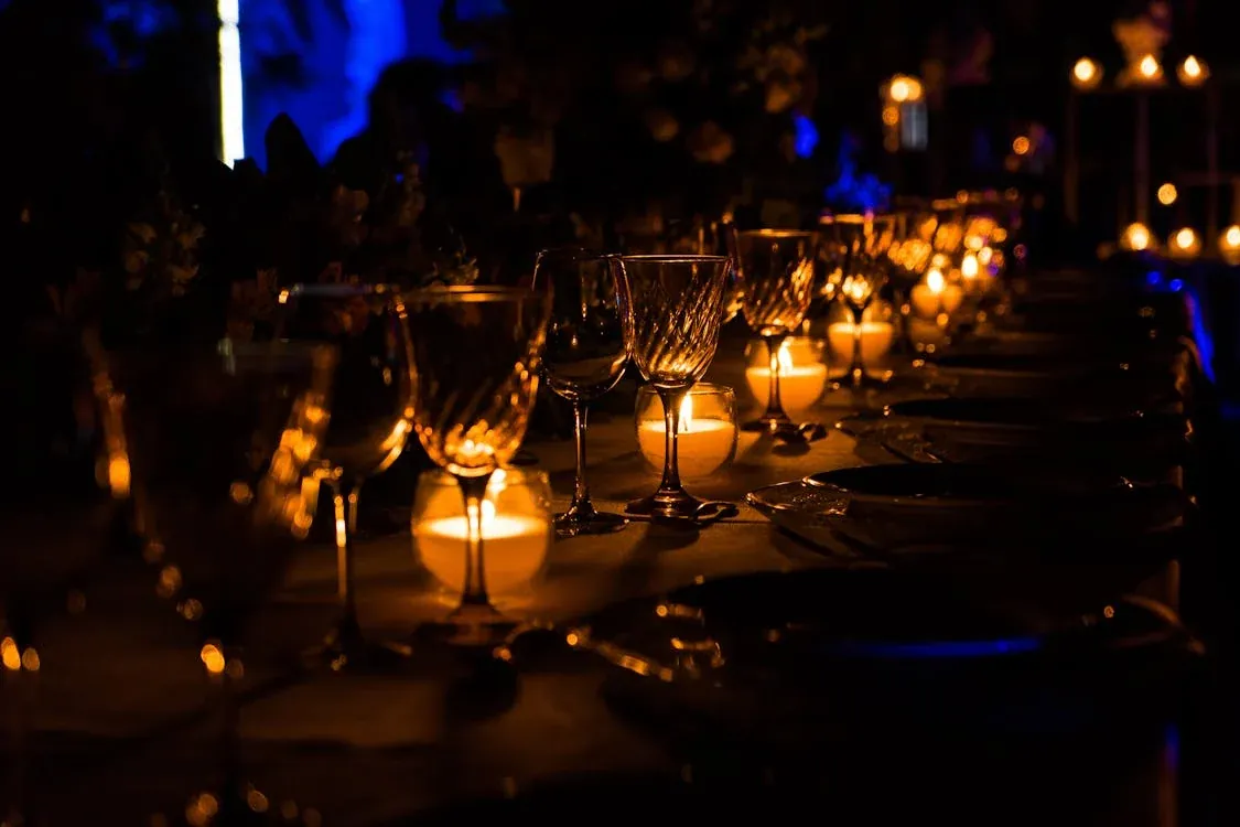 A candlelit dinner table set for an intimate gathering